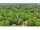 This property is surrounded by lush tree coverage, creating a serene environment at 1275 Smokehouse Trl, Cumming, GA 30041