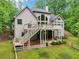 A beautiful backyard with an elevated deck and fenced-in area provides an ideal space for outdoor entertaining at 1275 Smokehouse Trl, Cumming, GA 30041