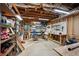 Unfinished basement with workbench, pegboard, and shelving providing a practical space for projects and storage at 1275 Smokehouse Trl, Cumming, GA 30041