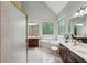 Bright and spacious bathroom with a large tub and elegant mirrors at 1275 Smokehouse Trl, Cumming, GA 30041