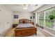 Comfortable bedroom with natural light, ceiling fan, and neutral decor at 1275 Smokehouse Trl, Cumming, GA 30041