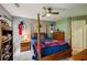Charming bedroom with a ceiling fan and bright natural light at 1275 Smokehouse Trl, Cumming, GA 30041