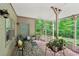 Inviting covered patio with brick flooring, outdoor furniture, and plant accents offering a relaxing outdoor retreat at 1275 Smokehouse Trl, Cumming, GA 30041