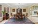 Formal dining room featuring elegant decor, wainscoting, and a stunning chandelier at 1275 Smokehouse Trl, Cumming, GA 30041