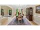 Stately dining room with wood furniture, chandelier, and open floorplan at 1275 Smokehouse Trl, Cumming, GA 30041