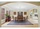 Beautiful dining room enhanced by custom trim, chandelier lighting, and view to living space at 1275 Smokehouse Trl, Cumming, GA 30041