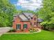 Beautiful two-story brick home with a landscaped front yard at 1275 Smokehouse Trl, Cumming, GA 30041