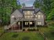 Charming house with a spacious deck, nestled in a serene wooded setting with mature trees at 1275 Smokehouse Trl, Cumming, GA 30041