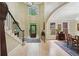 Inviting foyer with high ceilings, wooden staircase, elegant lighting and hardwood floors at 1275 Smokehouse Trl, Cumming, GA 30041