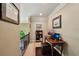 Upstairs hallway features a built in desk, office equipment, and railing to the downstairs at 1275 Smokehouse Trl, Cumming, GA 30041