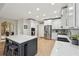 Spacious kitchen with white cabinets, stainless steel appliances, and center island with eat-in seating at 1275 Smokehouse Trl, Cumming, GA 30041