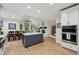 Spacious kitchen featuring a breakfast nook, island with seating, and hardwood flooring at 1275 Smokehouse Trl, Cumming, GA 30041
