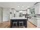 Bright updated kitchen with white cabinets, stainless appliances, and a center island with seating at 1275 Smokehouse Trl, Cumming, GA 30041