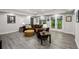 Living room features recessed lighting, wood look flooring, and access to outdoor living at 1275 Smokehouse Trl, Cumming, GA 30041