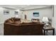 Living room offers recessed lighting, wood look flooring, and a large sectional sofa at 1275 Smokehouse Trl, Cumming, GA 30041