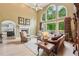 Spacious living room with fireplace, complemented by large windows and stylish decor at 1275 Smokehouse Trl, Cumming, GA 30041