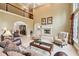 Inviting living room with fireplace, complemented by dining area, creating a welcoming space at 1275 Smokehouse Trl, Cumming, GA 30041