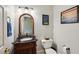 Classic powder room with a decorative mirror and charming accents at 1275 Smokehouse Trl, Cumming, GA 30041