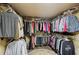 Spacious walk-in closet with extensive shelving and hanging storage for clothing and accessories at 1275 Smokehouse Trl, Cumming, GA 30041