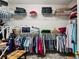 Walk-in closet with clothing racks, wire shelves, and storage for folded items at 1275 Smokehouse Trl, Cumming, GA 30041