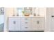 Bathroom vanity with double sinks, white cabinets, and modern black hardware at 1712 Fulmont Cir, Mableton, GA 30126