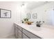 Bright bathroom with double vanity, white countertops and gray cabinets at 1712 Fulmont Cir, Mableton, GA 30126