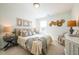 Comfortable bedroom featuring neutral color scheme, decorative wall art, and soft bedding at 1712 Fulmont Cir, Mableton, GA 30126