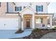 Charming brick and siding two-story home with a well-manicured front lawn at 1712 Fulmont Cir, Mableton, GA 30126
