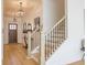 Elegant foyer with a staircase, modern lighting, and hardwood flooring at 1712 Fulmont Cir, Mableton, GA 30126
