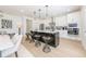 Kitchen with stainless appliances, central island, hardwood floors, and dining area at 1712 Fulmont Cir, Mableton, GA 30126