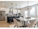 Modern eat-in kitchen with stainless steel appliances and a large island with bar stool seating at 1712 Fulmont Cir, Mableton, GA 30126