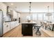Kitchen with stainless appliances, central island, hardwood floors, and dining area at 1712 Fulmont Cir, Mableton, GA 30126