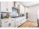Modern kitchen featuring sleek white cabinetry and stainless steel appliances at 1712 Fulmont Cir, Mableton, GA 30126