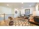 Cozy upstairs living room featuring a comfortable gray couch and stylish decor at 1712 Fulmont Cir, Mableton, GA 30126