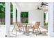 Outdoor patio with seating area, fans, and a view of the lush landscape at 1712 Fulmont Cir, Mableton, GA 30126