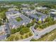 Aerial showcasing proximity to shopping and roads, nestled among mature trees, enhancing its appeal at 1850 Cotillion Dr # 3114, Atlanta, GA 30338