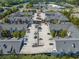 Close aerial showcasing ample parking and well-maintained rooftops of the residential building at 1850 Cotillion Dr # 3114, Atlanta, GA 30338