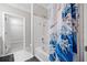 This bathroom features a shower-tub combo and a colorful shower curtain at 1850 Cotillion Dr # 3114, Atlanta, GA 30338