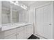 Spacious bathroom with double sinks, marble countertops, and white cabinetry at 1850 Cotillion Dr # 3114, Atlanta, GA 30338