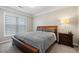 Bedroom with dark furniture, a window, and neutral color scheme at 1850 Cotillion Dr # 3114, Atlanta, GA 30338