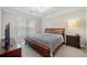 Bedroom with dark furniture, a window, and neutral color scheme at 1850 Cotillion Dr # 3114, Atlanta, GA 30338