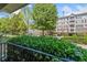 Exterior view of a multifamily building with balconies and mature landscaping in front at 1850 Cotillion Dr # 3114, Atlanta, GA 30338