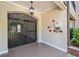Secured entryway with a metal gate, call box, and lighting fixture at 1850 Cotillion Dr # 3114, Atlanta, GA 30338