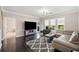 Bright living room with a comfortable seating area, large windows, and dark hardwood floors at 1850 Cotillion Dr # 3114, Atlanta, GA 30338