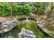 Scenic pond with a fountain feature surrounded by lush landscaping at 1850 Cotillion Dr # 3114, Atlanta, GA 30338