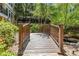 Charming wooden bridge surrounded by lush greenery near the building at 1850 Cotillion Dr # 3114, Atlanta, GA 30338