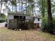 Back exterior of home with a wooden deck and access to a spacious yard at 1962 Clairmont Ter, Atlanta, GA 30345