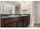 Bathroom featuring double sinks, dark wood cabinets, and tile flooring at 3225 Rex Ridge Dr, Rex, GA 30273