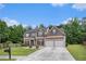 Beautiful brick home with a two-car garage and lush landscaping in a serene setting at 3225 Rex Ridge Dr, Rex, GA 30273