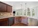 Well-lit kitchen featuring granite countertops, modern appliances, and hardwood floors at 3225 Rex Ridge Dr, Rex, GA 30273